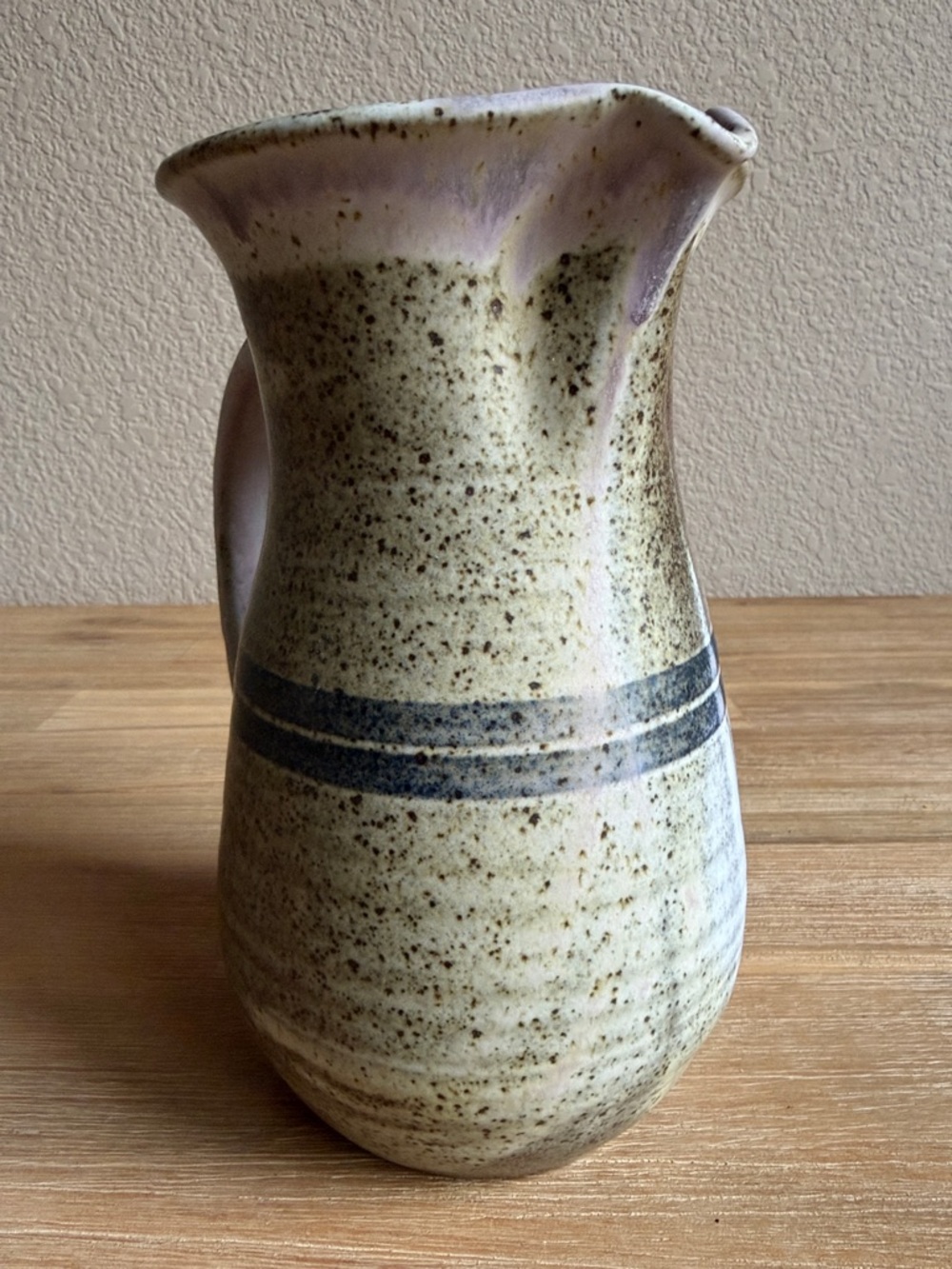 Handcrafted Speckled Ceramic Pitcher in Beige with Blue Stripe - Picture 2 of 13